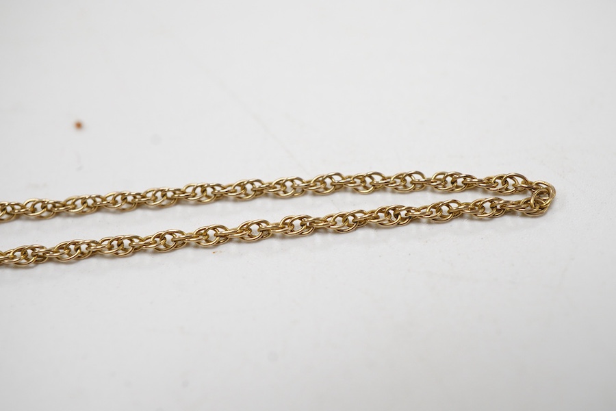 A collection 9ct brooches to include a shell cameo carved with the Three Graces, an amethyst set floral spray brooch, a cultured pearl set ribbon brooch, a garnet set bar brooch and a cultured pearl set stick pin, togeth